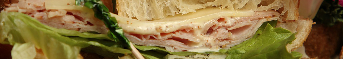 Eating Sandwich Cafe at Frame Gourmet Eatery restaurant in New York, NY.